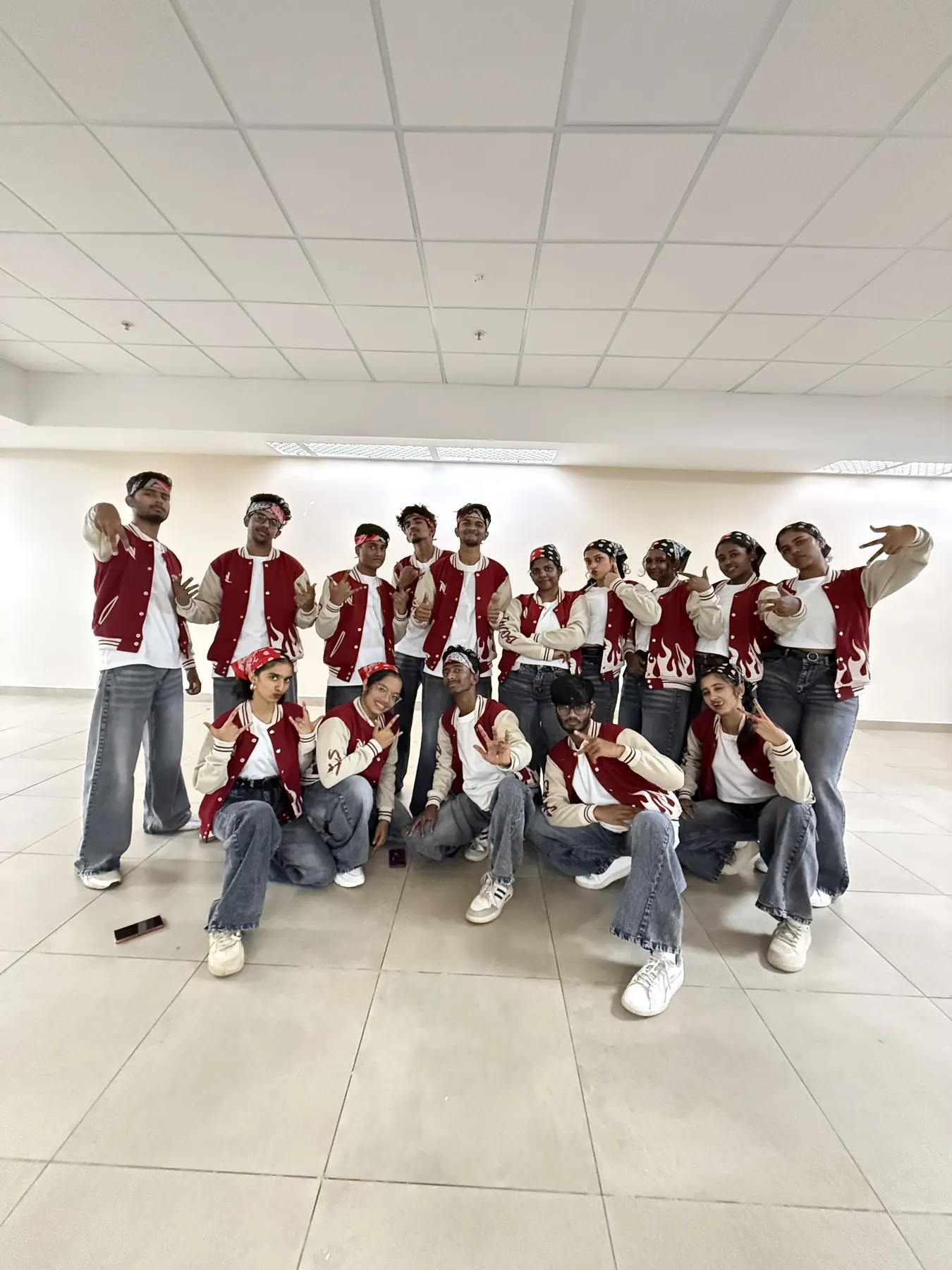 The Natyasudha crew in red varsity jackets