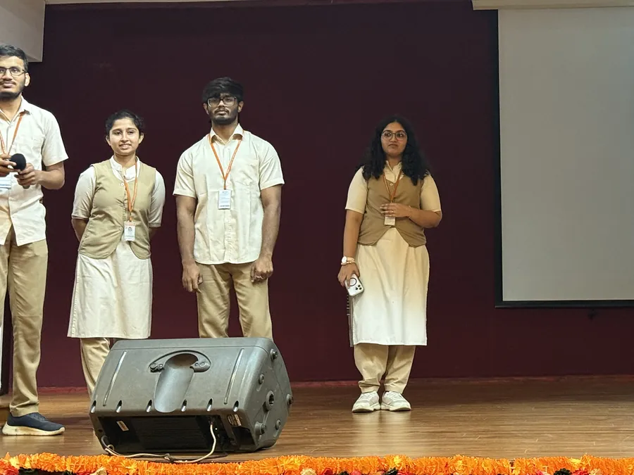 Suhas speaking to first-year students on stage