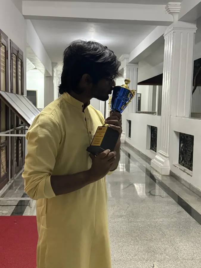 Suhas kissing the Gokulashtami 2025 winners' trophy